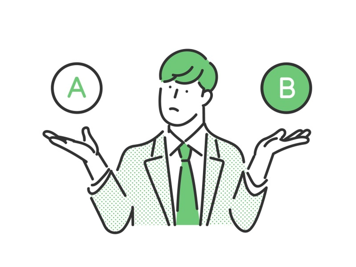 写真②AとBを比較をして考える男性