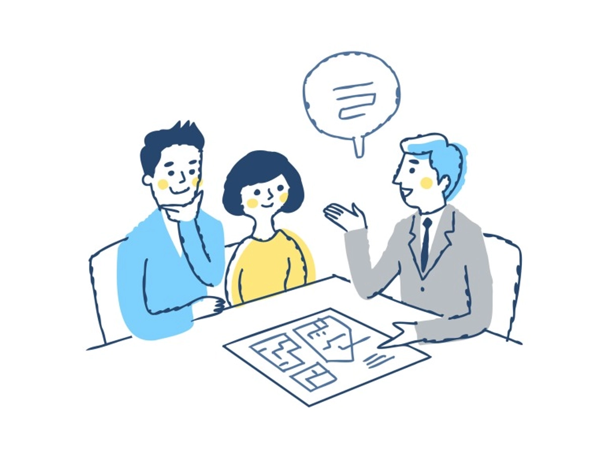 説明をしているビジネスマンと説明を聞くカップル