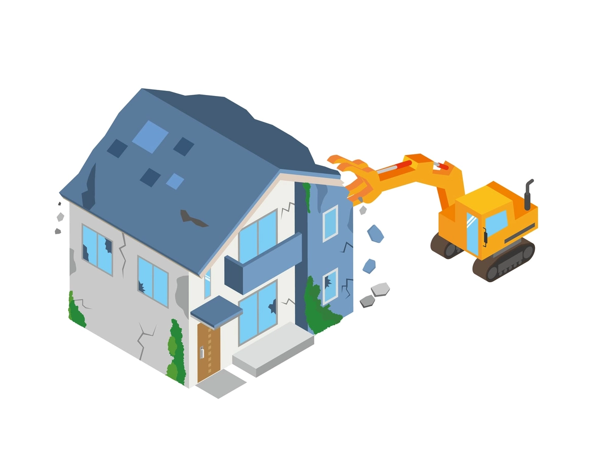 ショベルカーで解体される家